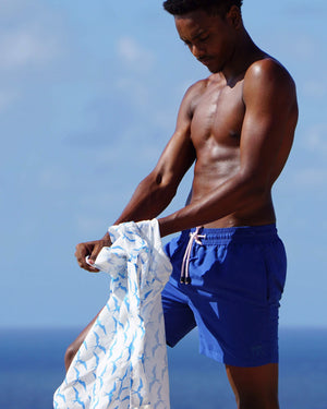 Mens beach holiday pack a linen shirt in Frigate Bird blue