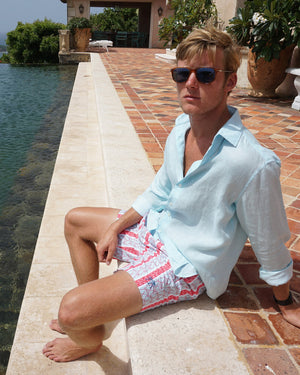 Mens designer Linen Shirt in plain Pale Blue by Lotty B, Mustique poolside