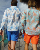 Holiday style linen shirt tropical palm print in white and blue by Lotty B Mustique