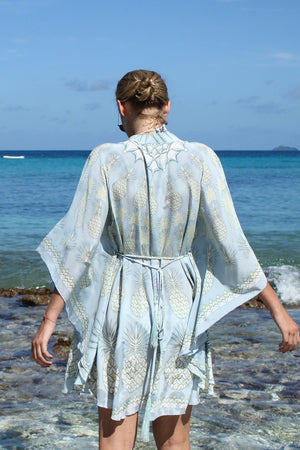 Lotty B Short Kaftan in Silk Crepe-de-Chine: PINEAPPLE - OLIVE back looking at the sea