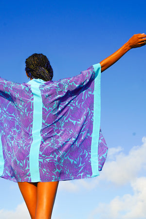 Silk holiday robe in violet & turquoise Protea print designed by Lotty B Mustique