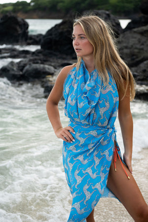 How to wear a silk sarong on the beach in Lurcher green & blue print designer Lotty B Mustique