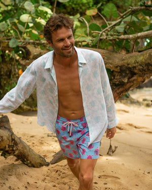Men's linen beach holiday shirt in aqua blue Turtle print by designer Lotty B Mustique