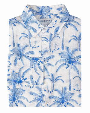 Mens linen holiday shirt tropical palm print in white and blue by Lotty B Mustique