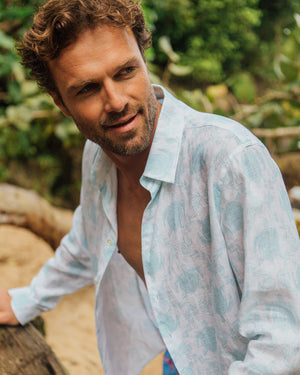 Men's linen shirt for beach vacations in aqua blue Turtle print by designer Lotty B Mustique