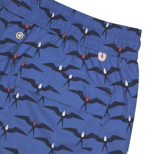 Swim trunks made to last from recycled fabric in holiday prints by Lotty B Mustique
