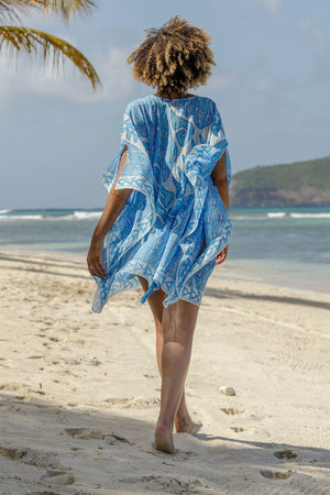 Lotty B Short Kaftan in Cotton (Shark, Blue) walk on the white sands of Mustique