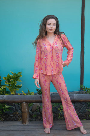 Retro luxury fashion, silk Lyla trouser suit in Fruit Punch orange print by designer Lotty B Mustique