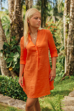 Tropical holiday style women's Decima dress in orange pure linen by Lotty B Mustique resortwear