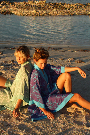 Silk vacation style in violet & turquoise Protea print designed by Lotty B Mustique