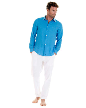 Mens designer Linen Shirt by Lotty B for Pink House Mustique in plain Turquoise Blue, model front